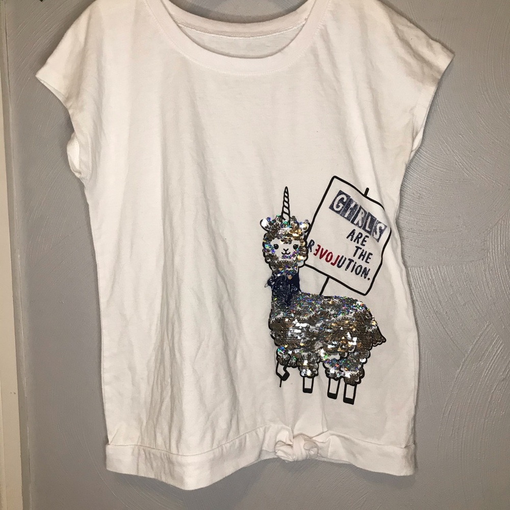 White she with silver sequence llama on it